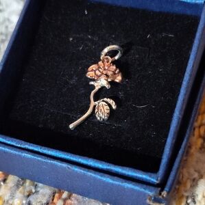 Silver and gold tone rose pendant